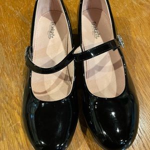 Girl’s black patent leather dress shoes